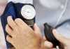 Pair of Human Hands Checking the Blood Pressure of a Patient Pair of Human Hands Checking the Blood Pressure of a Patient